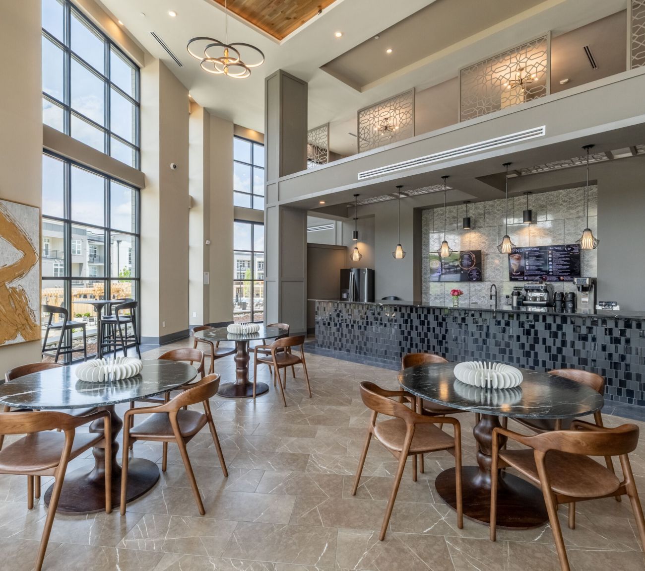 Fitness center with cardio and weight machines at McEwen Northside Apartments
